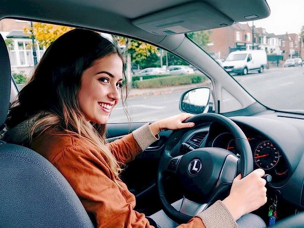 Driving instructor in a car with a learner on a London street