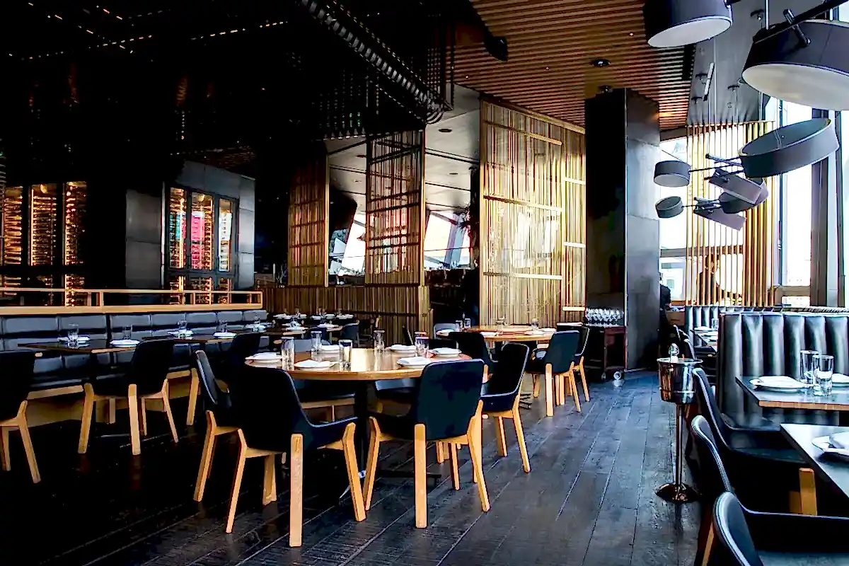 Stylish London restaurant interior with ambient lighting and a busy evening service.
