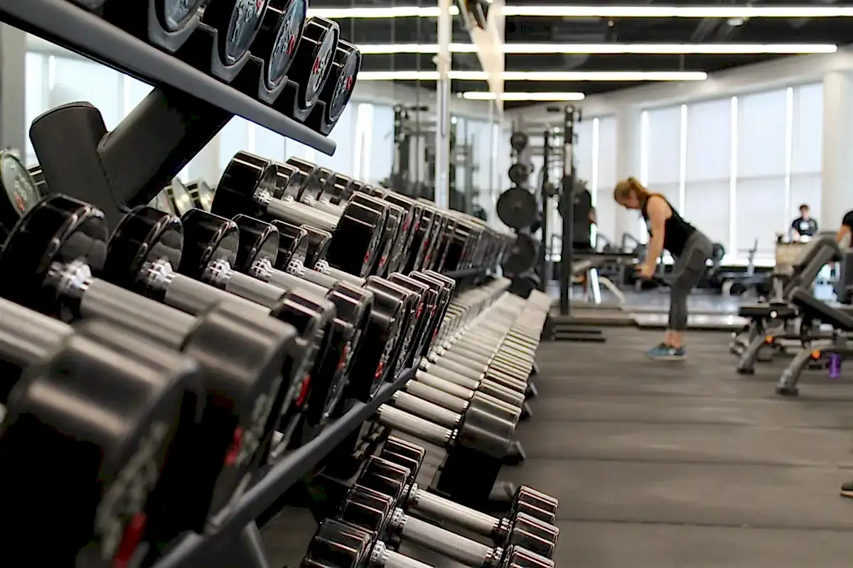 Modern London gym interior with professional weights equipment and clean lighting