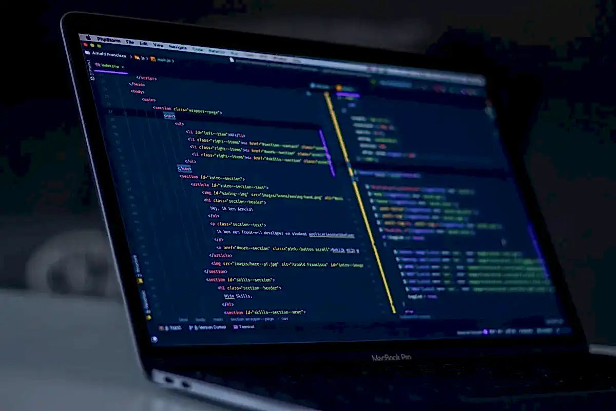 Developer writing clean code for a web application in a London studio.
