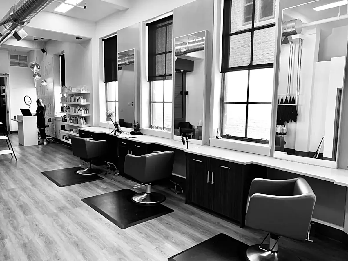 Elegant beauty salon interior with styling chairs and mirrors, London web design