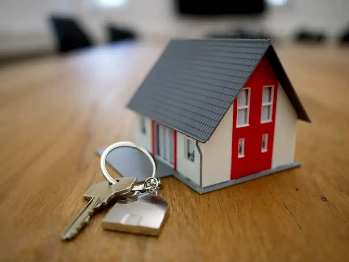 London estate agent office displaying premium property listings on digital screens.